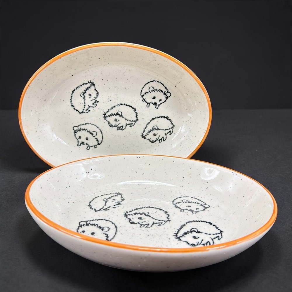 Meritage Hedgehog Speckled Stoneware Oval Bowls Set of 2 Orange Rim Cream Black